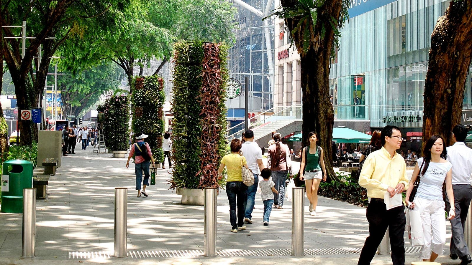 Shoppers on a tree-lined Orchard Road